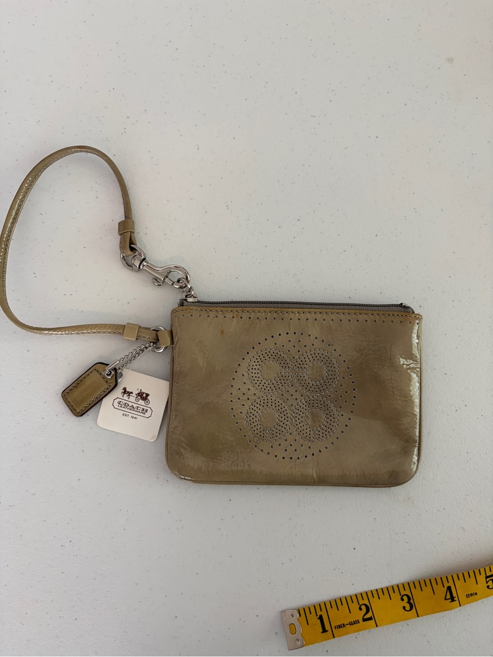 Coach Taupe Patent Leather Perforated Logo Wristlet